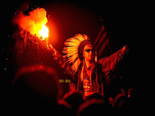 A man wearing a Native American war bonnet at the Glastonbury Festival. Source: Getty Images; Ollie Millington/Redferns. 