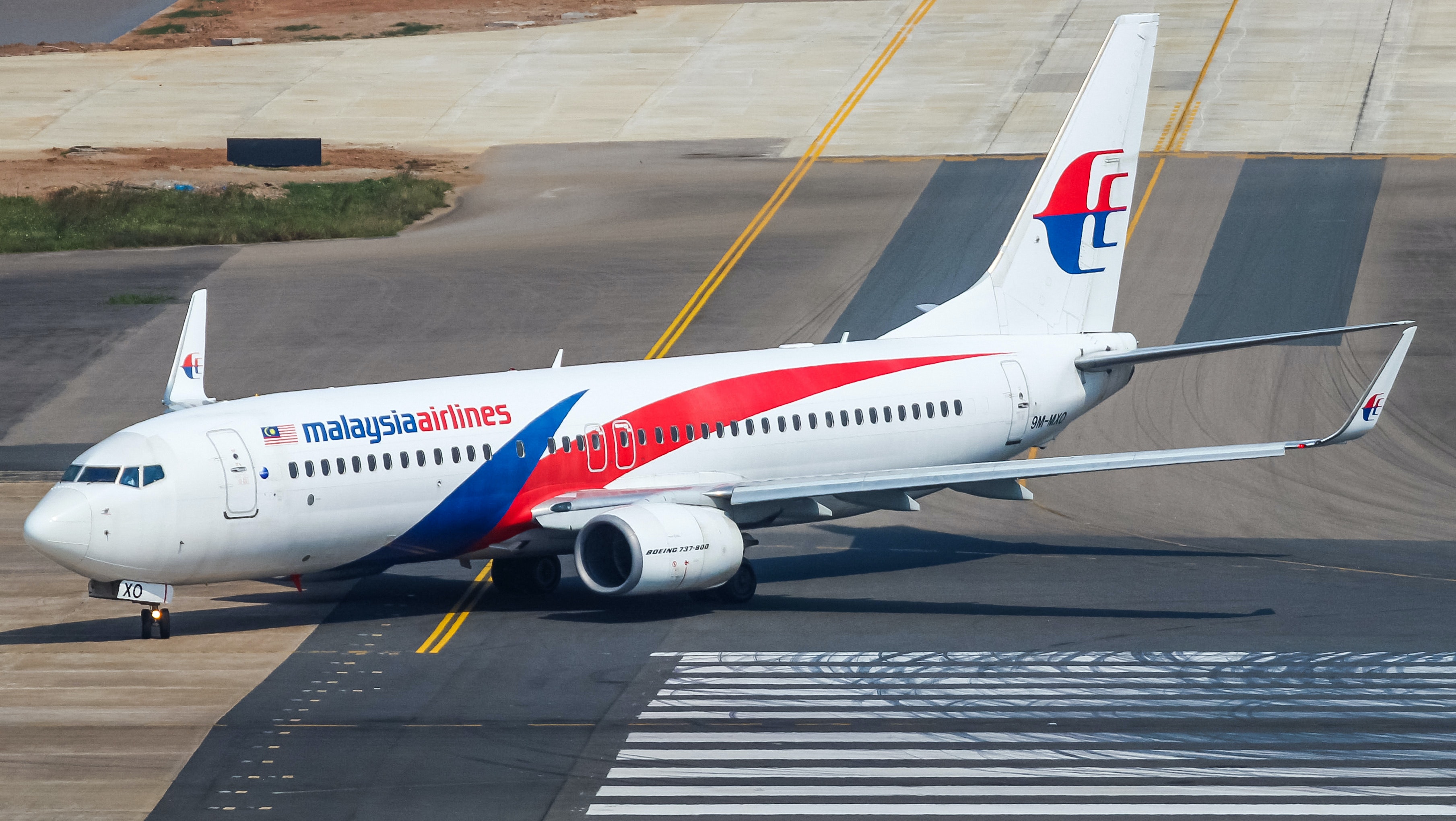 Man charged after claiming to have explosives on flight MH122